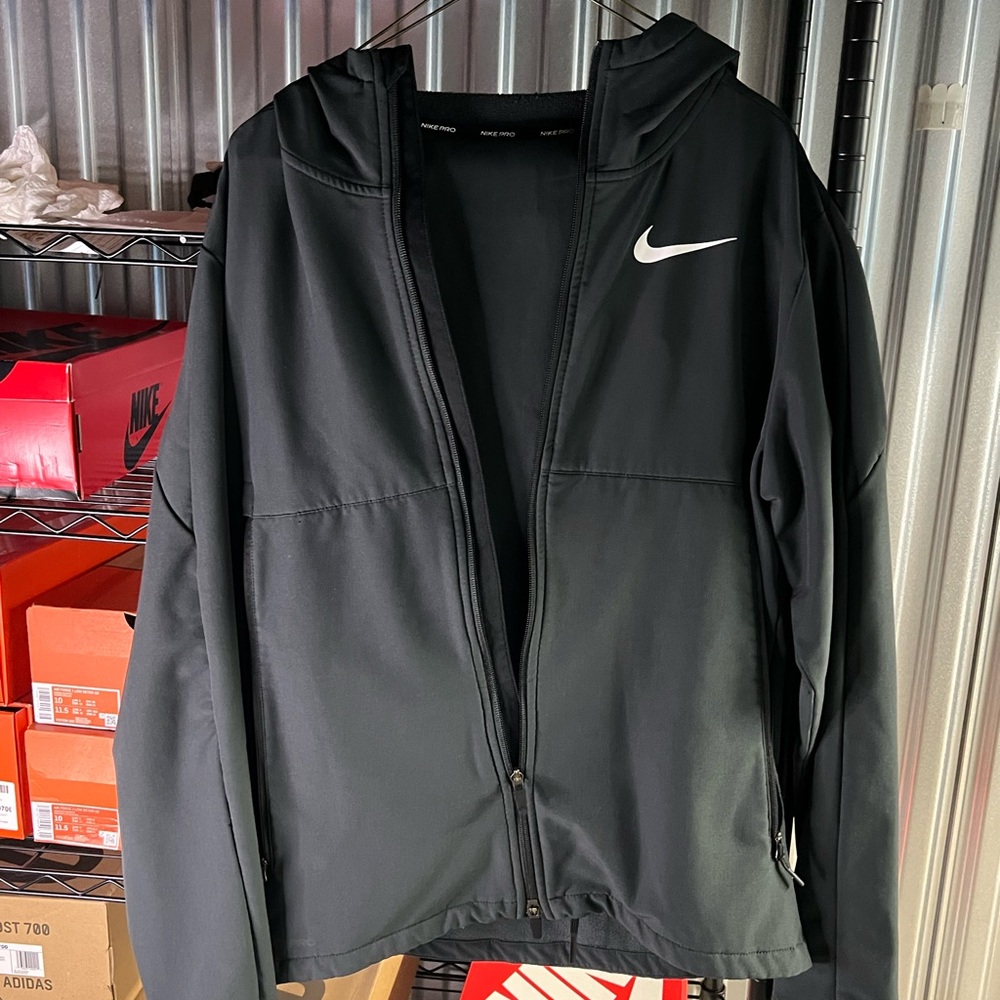 Nike Black Performance Jacket with Hood and Streamlined Design with the pants